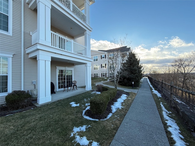 view of home's community with a lawn