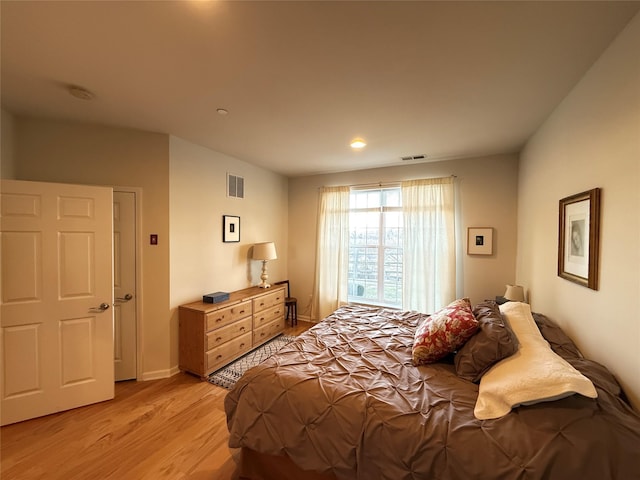 bedroom with light hardwood / wood-style floors