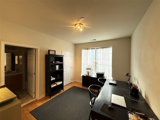 home office featuring light hardwood / wood-style floors