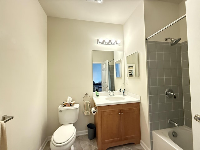 full bathroom with tiled shower / bath, vanity, tile patterned floors, and toilet