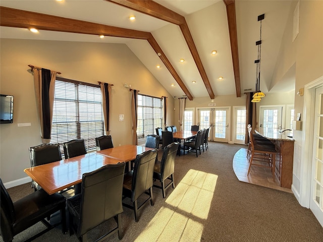 dining room with beamed ceiling, carpet flooring, high vaulted ceiling, and french doors