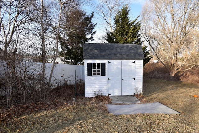 view of outbuilding featuring a lawn