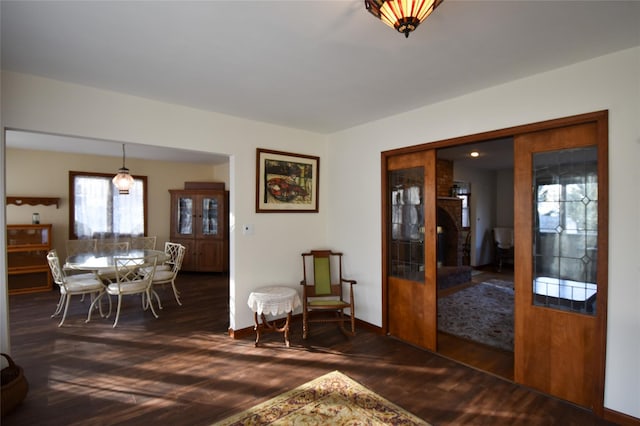 dining area featuring dark wood-type flooring