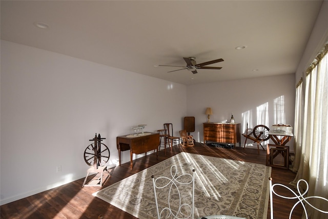 interior space with dark hardwood / wood-style floors and ceiling fan