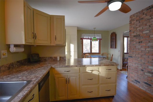 kitchen featuring sink, dark hardwood / wood-style flooring, decorative light fixtures, stainless steel dishwasher, and kitchen peninsula