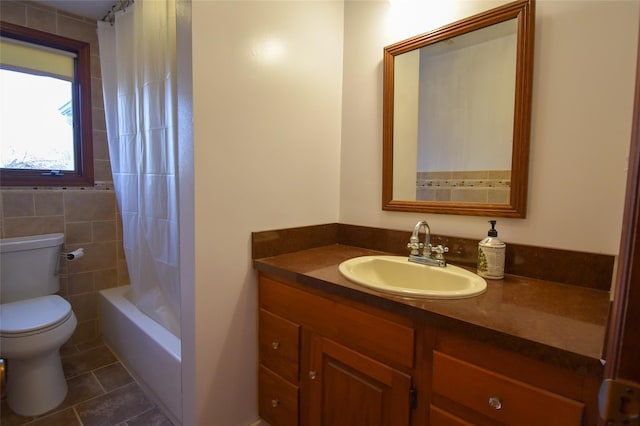 full bathroom with vanity, shower / bathtub combination with curtain, tile patterned floors, and toilet