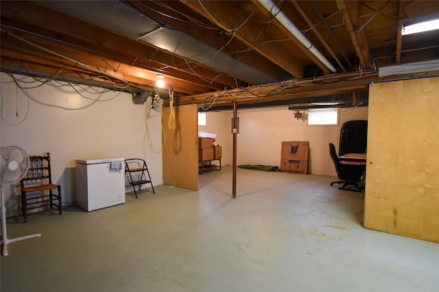 basement featuring fridge