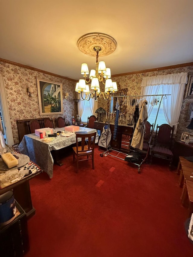 dining room with crown molding, carpet flooring, and a chandelier