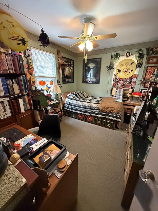 bedroom with ceiling fan and carpet flooring