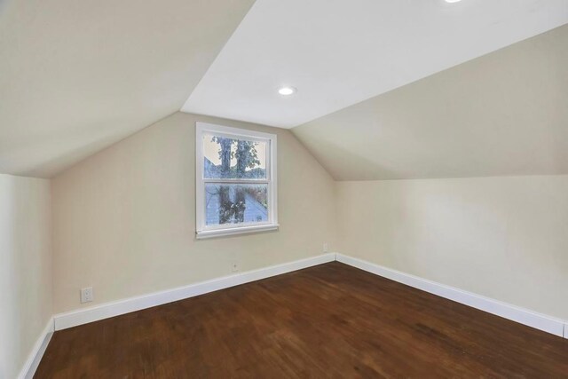 bonus room featuring lofted ceiling and wood-type flooring