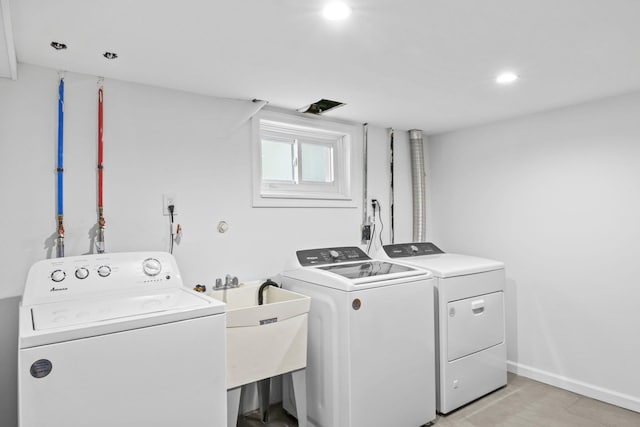 laundry room with independent washer and dryer