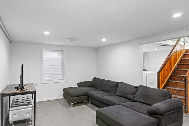 living room featuring washer / dryer