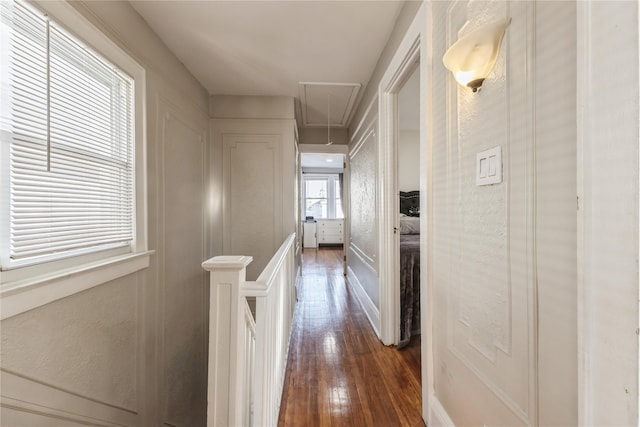 corridor with dark hardwood / wood-style floors