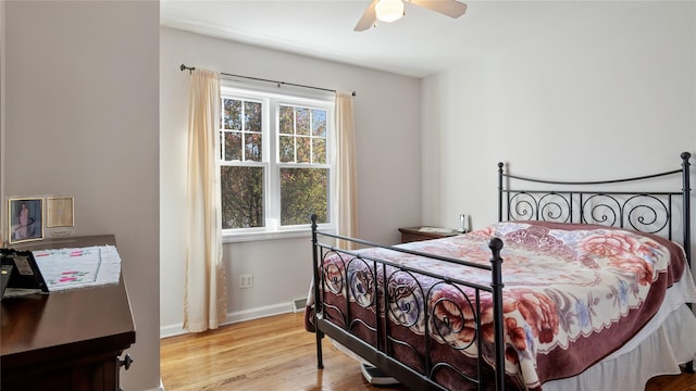 bedroom featuring hardwood / wood-style floors and ceiling fan