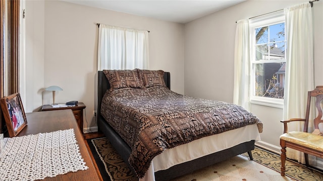 bedroom with dark hardwood / wood-style flooring