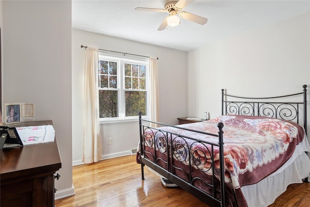 bedroom featuring light hardwood / wood-style flooring and ceiling fan