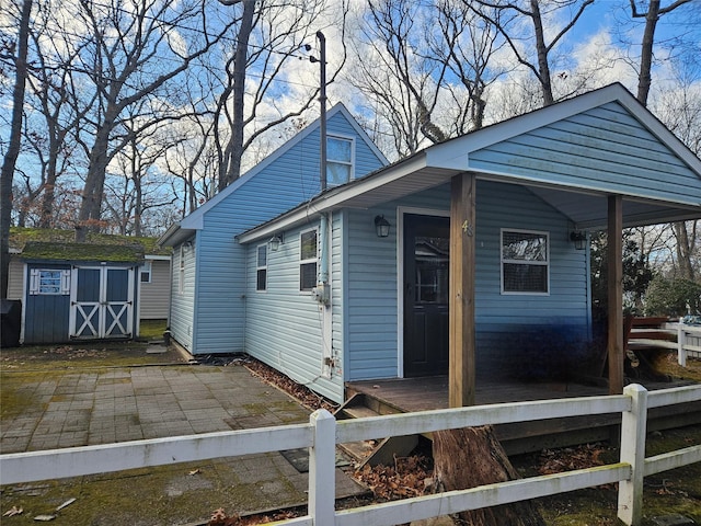 exterior space with a storage shed