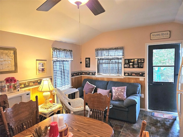 living room with lofted ceiling and ceiling fan