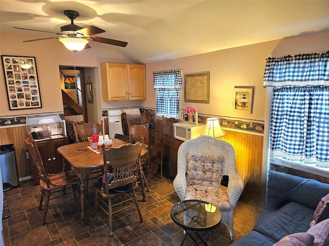 dining area featuring vaulted ceiling and ceiling fan