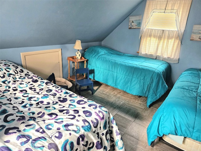 bedroom featuring lofted ceiling