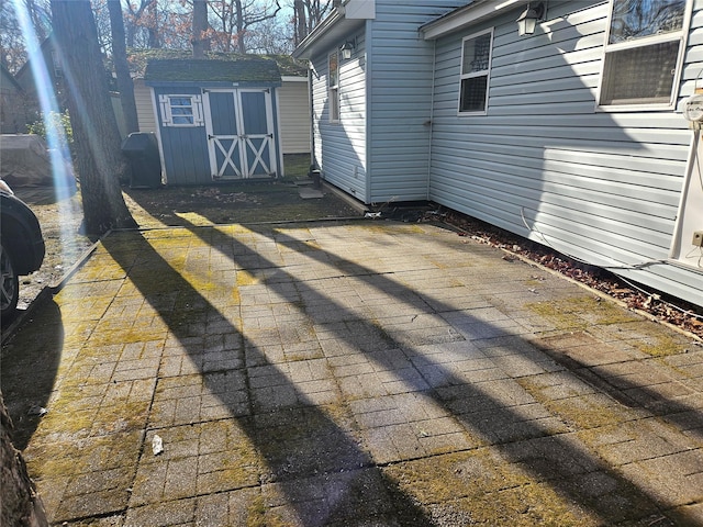 view of patio / terrace with a storage unit