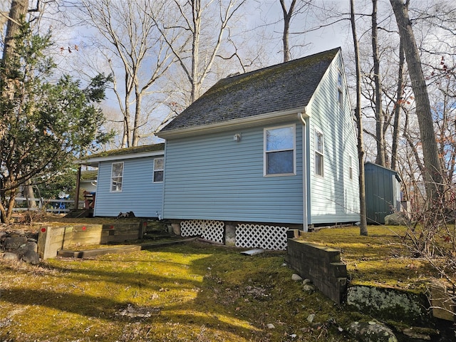 view of property exterior with a yard