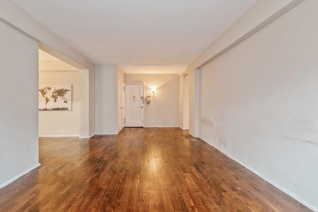 hall with dark hardwood / wood-style floors