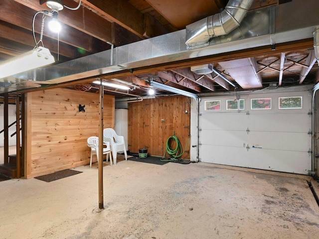 garage featuring wooden walls