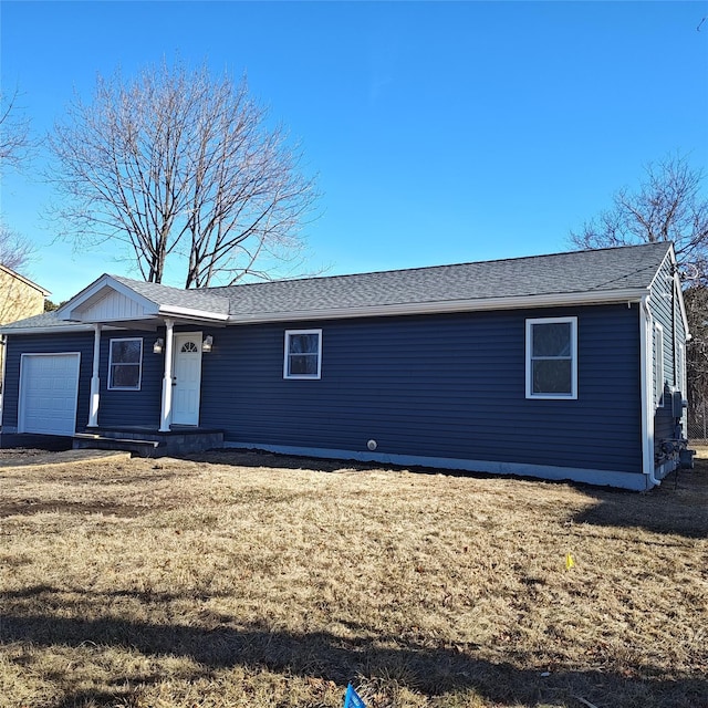 single story home with a garage and a front yard