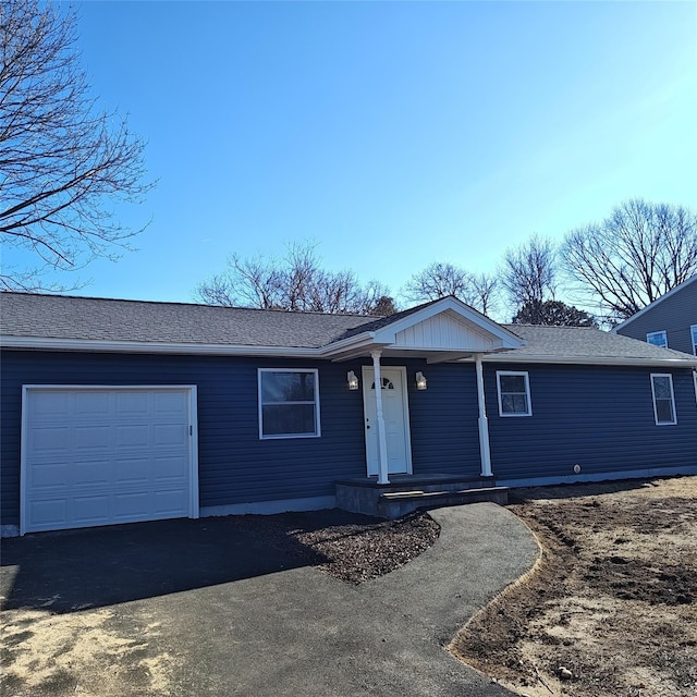 single story home with a garage