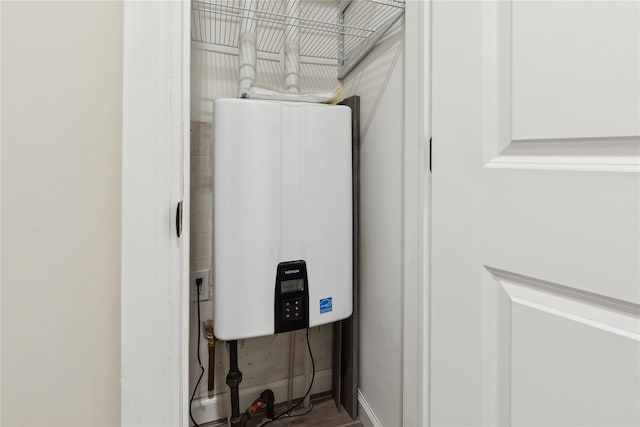 utility room with tankless water heater