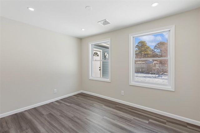 unfurnished room featuring hardwood / wood-style floors