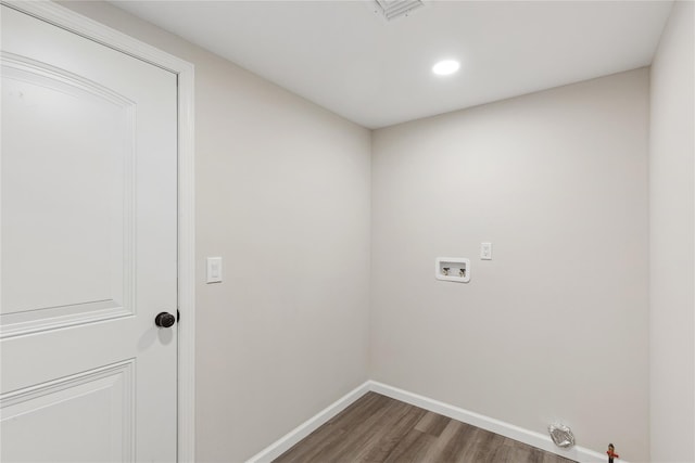 washroom featuring washer hookup, hookup for a gas dryer, and dark hardwood / wood-style flooring