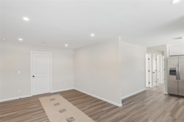 empty room with light wood-type flooring