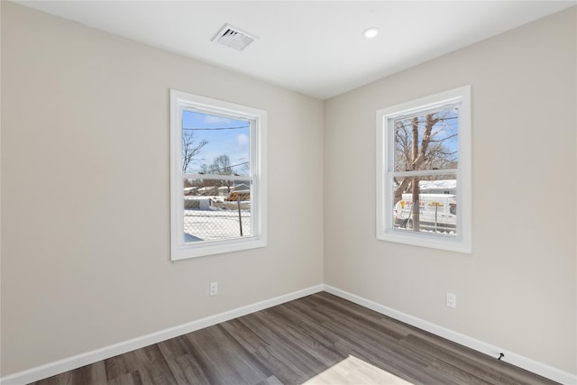 unfurnished room featuring dark wood-type flooring