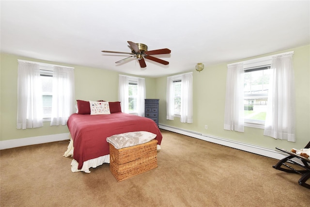 bedroom featuring baseboard heating, light colored carpet, and ceiling fan