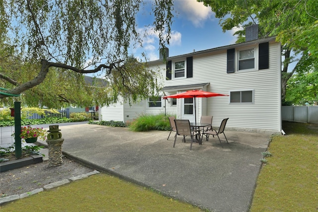 back of house with a patio area