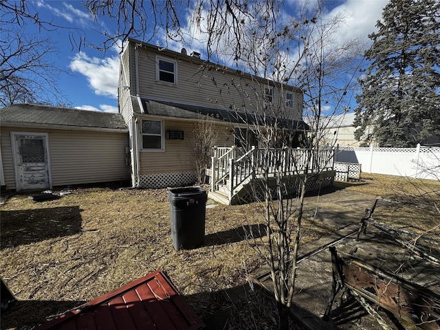 back of property with a wooden deck