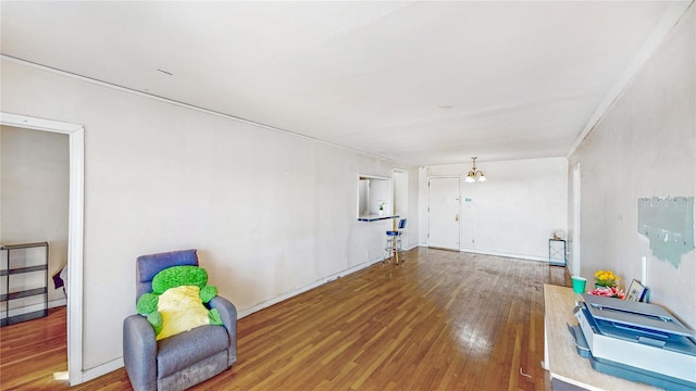 interior space with hardwood / wood-style floors and an inviting chandelier