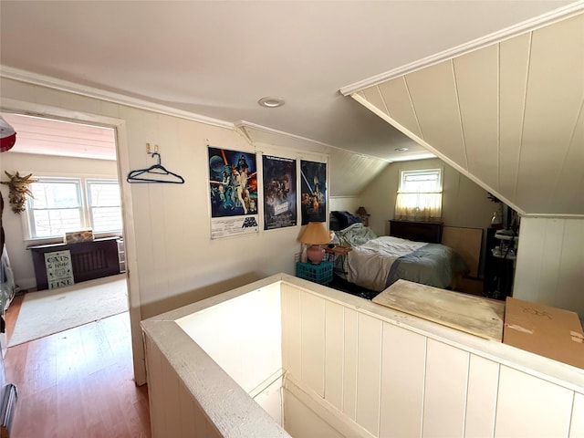 253 William St, West Hempstead, NY 11552 - bedroom with light wood-style floors, lofted ceiling, and ornamental molding
