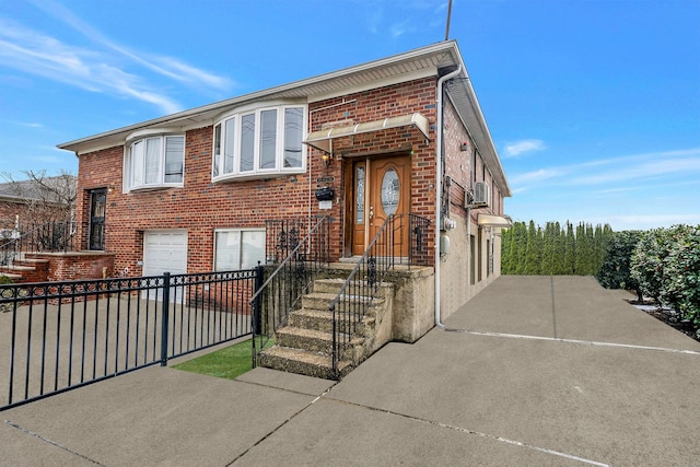 bi-level home featuring a garage