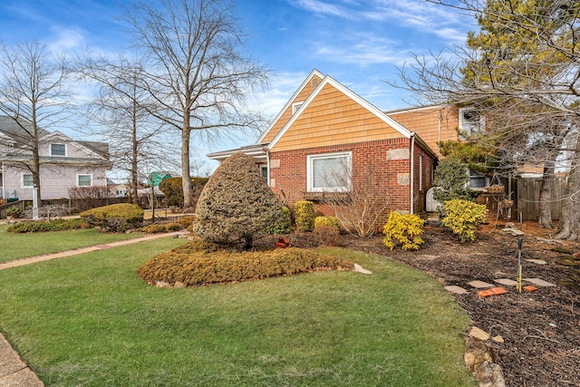 view of side of property with a lawn