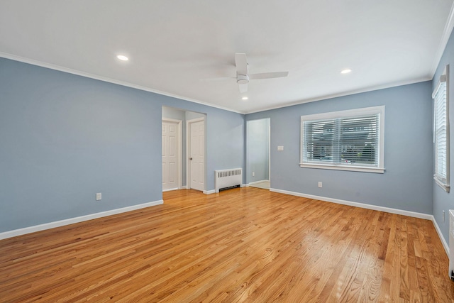 unfurnished bedroom with ceiling fan, ornamental molding, radiator heating unit, and light wood-type flooring