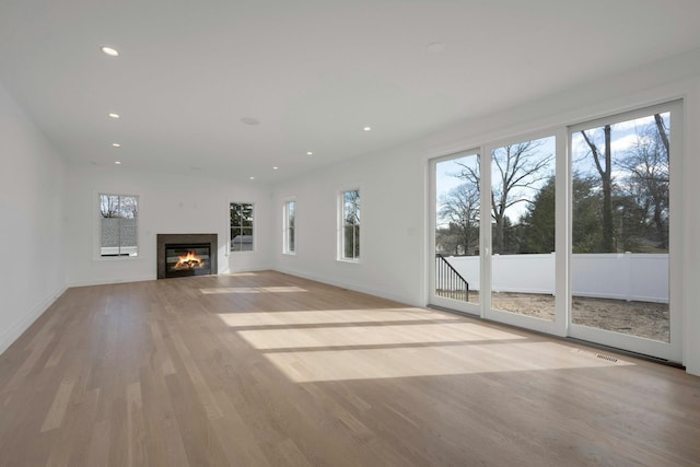 unfurnished living room featuring light hardwood / wood-style floors