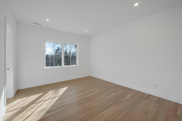 unfurnished room with light hardwood / wood-style floors