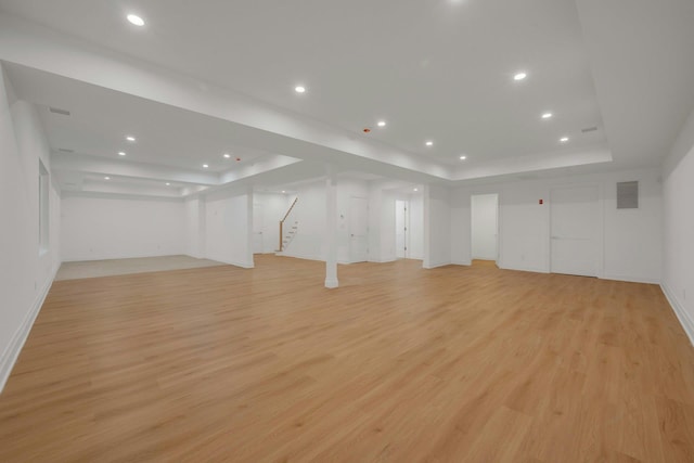 basement featuring light hardwood / wood-style flooring