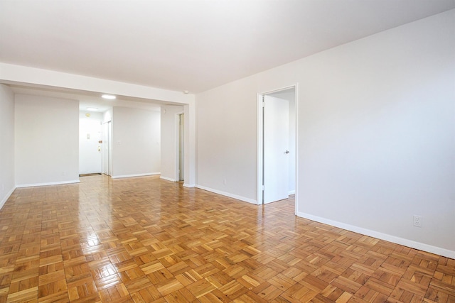 spare room with light parquet flooring