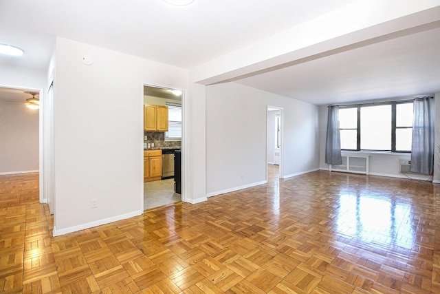 unfurnished living room with light parquet flooring