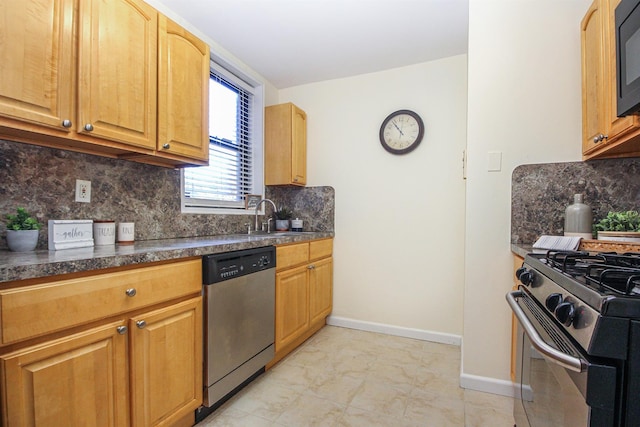 kitchen featuring stainless steel appliances, tasteful backsplash, and sink