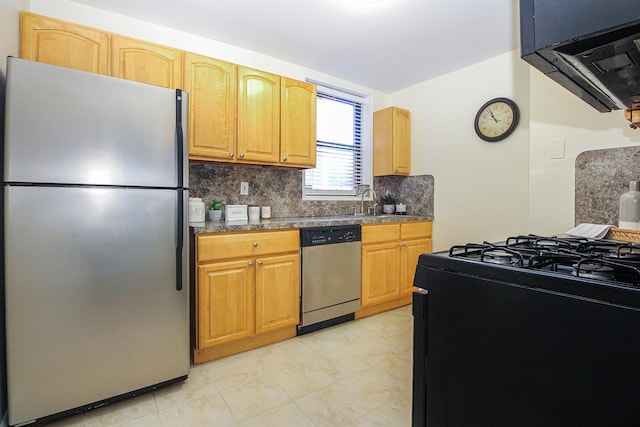 kitchen with sink, decorative backsplash, and appliances with stainless steel finishes